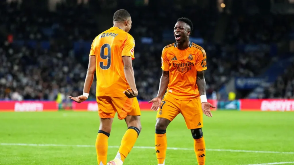 Vinicius Júnior quer receber salário próximo ao de Mbappé no Real Madrid.